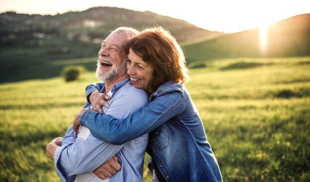 couple hugging at mountain side